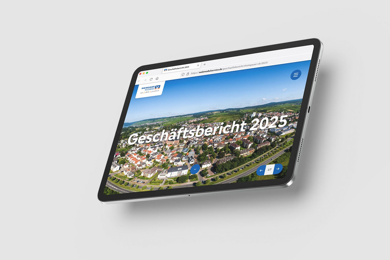 Tablet mit geöffneter Webseite, die eine Luftaufnahme von Geisenheim und den Text 'Geschäftsbericht 2025' zeigt