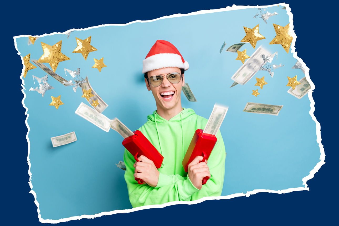 Person mit Weihnachtsmütze und Geldkanonen