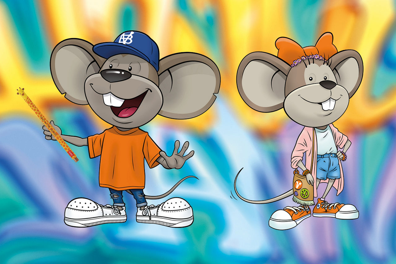Hanni mit orangener Haarschleife und Manni mit Legami-Giraffenstift vor buntem Hintergrund