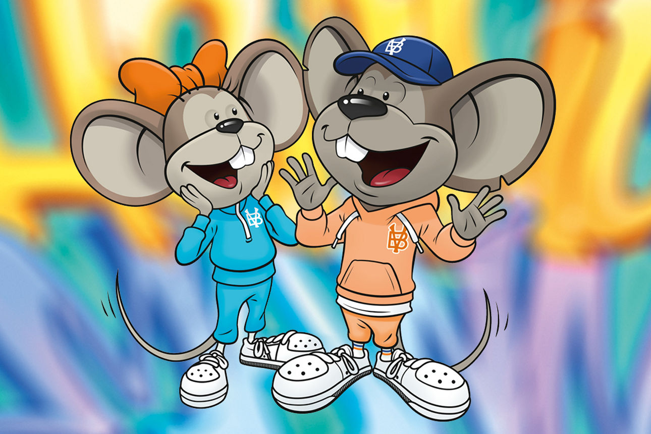 Hanni und Manni sportlich gekleidet vor buntem Hintergrund