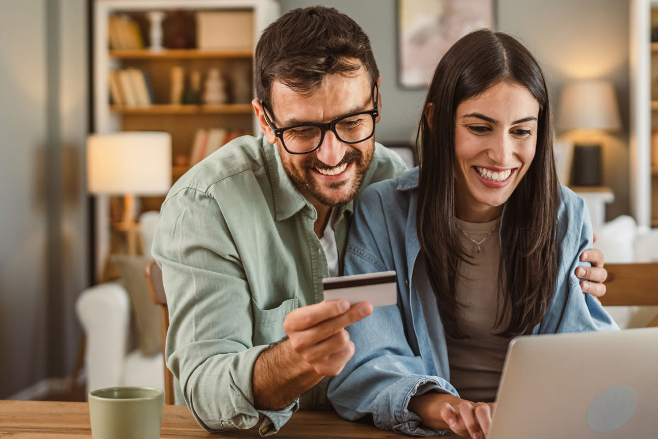 Businesswoman shaking hands with a businessman during a job interview, happy to be hired for a new job