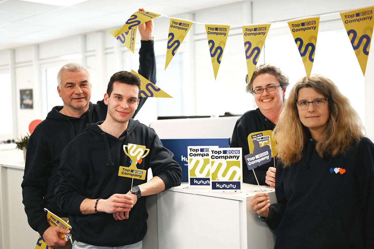 Gruppenbild mit Kununu-Siegel