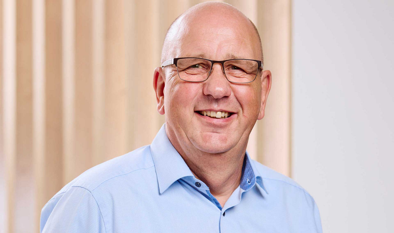 Ralf Kalk lächelt in die Kamera 