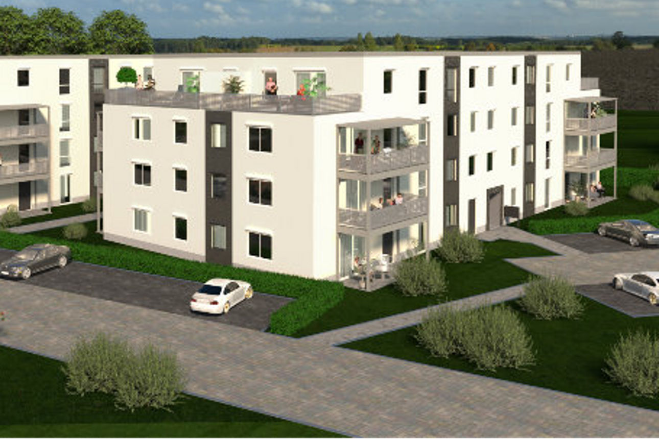 Ein modernes, mehrstöckiges Wohngebäude mit weißen Fassaden und Balkonen. 