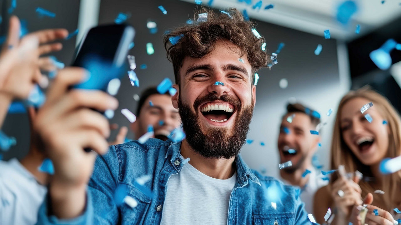 Eine Gruppe Erwachsener freut sich und wirft mir blauen Konfetti um sich