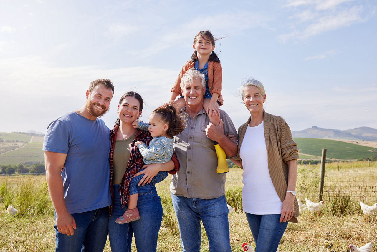 Family, children and portrait at farm, chicken or love in summer, outdoor or smile with bonding in countryside. People, kids and happy on field for poultry, meat or egg production with care in Spain.