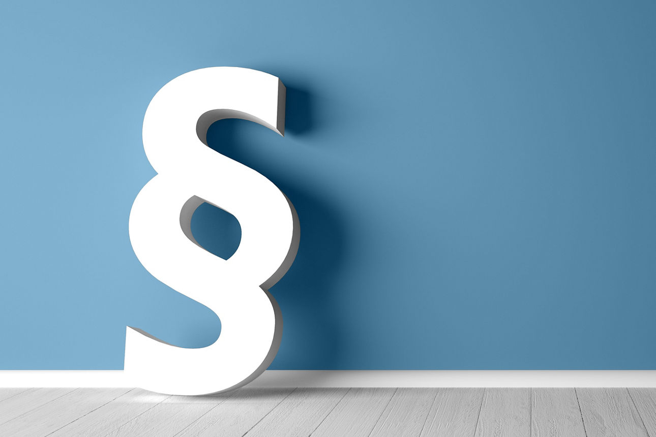 Paragraphensymbol vor blauem Hintergrund