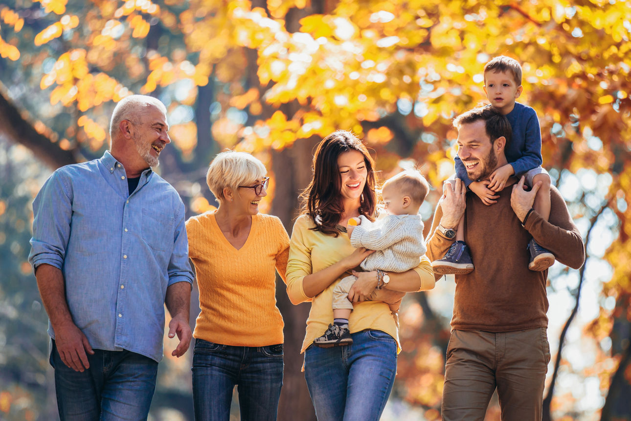 Multl generation family in autumn park having fun