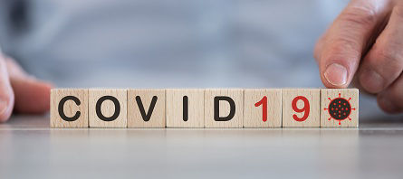 Concept of Covid-19 on wooden cubes