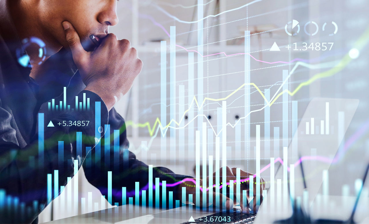 African American businessman or stock trader analyzing stock graph chart, side view stock trader using laptop to buy or sell shares, double exposure graph, internet trading concept.