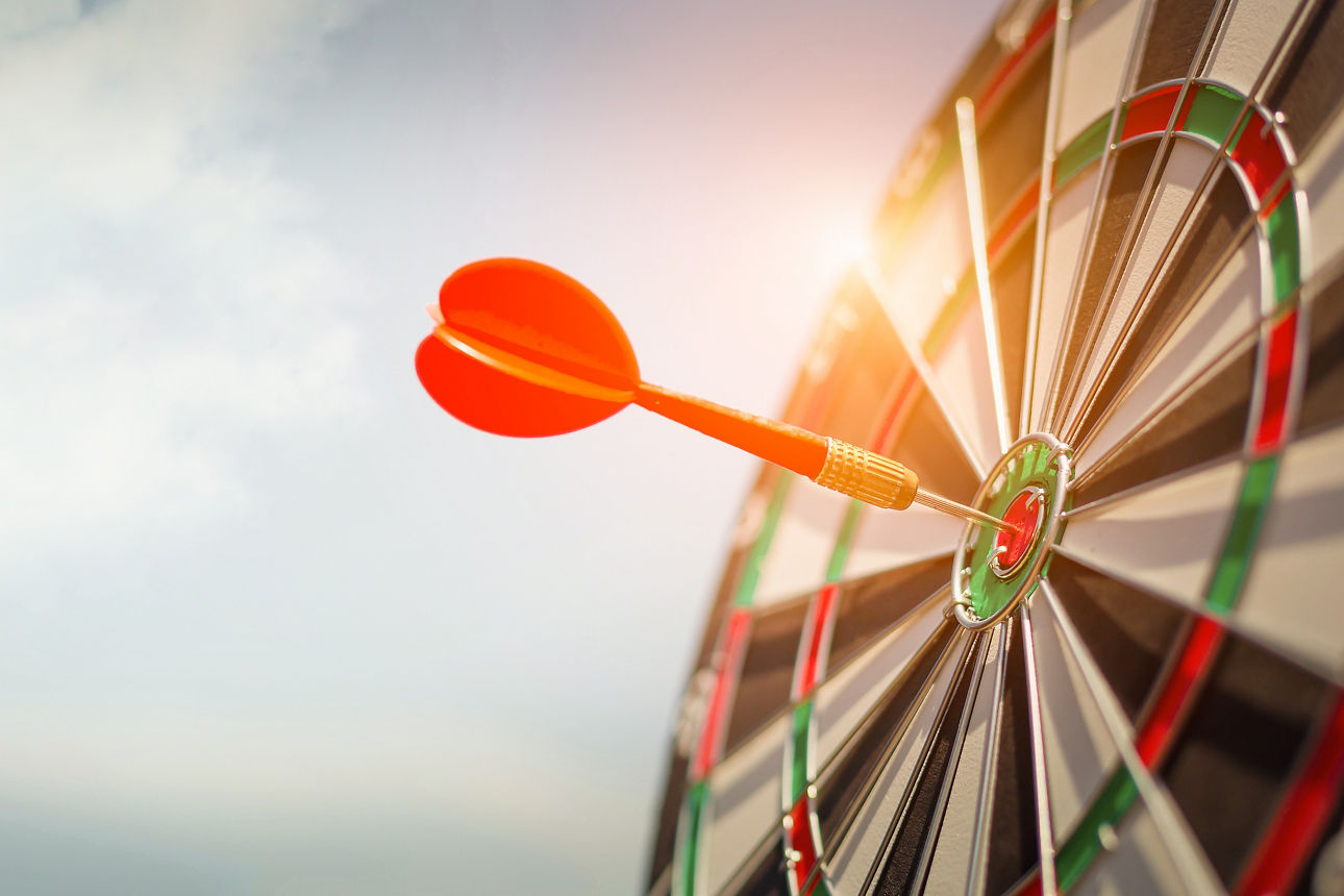Red dart target with arrows ,Image for target business, marketing solution concept.of dartboard with sky background.