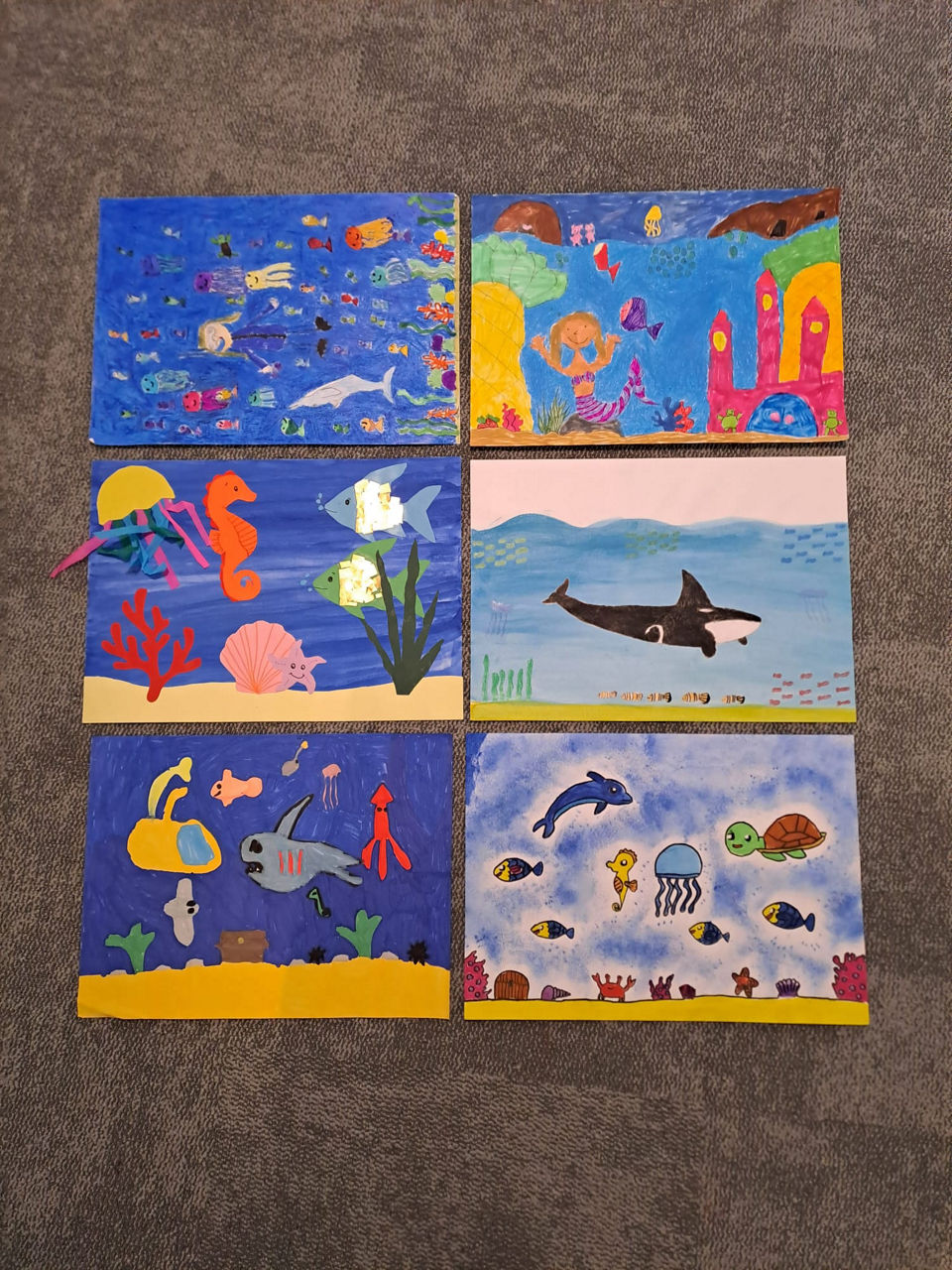6 gemalte Bilder von Kindern der Klassen 1 und 2