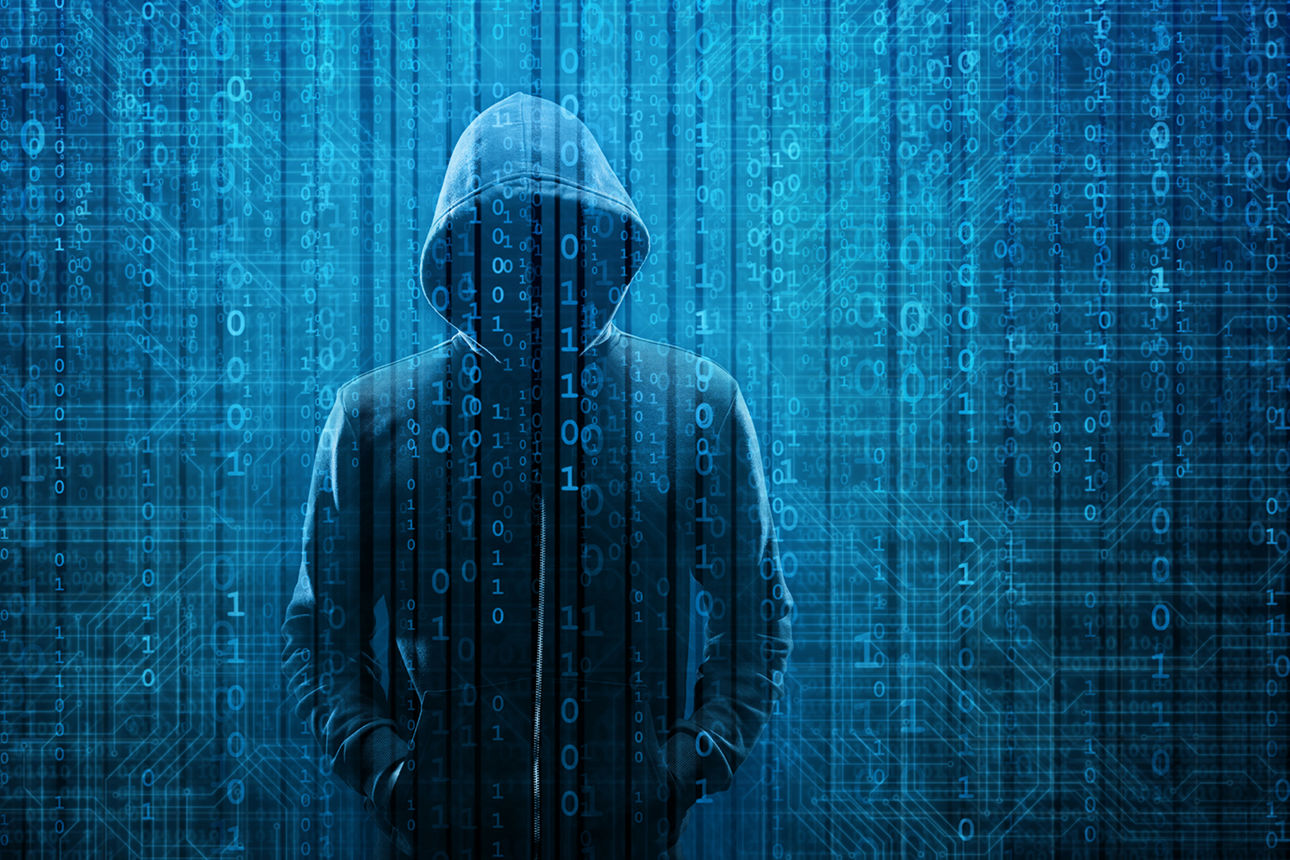 Computer Hacker in Hoodie. Obscured Dark Face. Hacker Attack, Virus Infected Software, Dark Web and Cyber Security Concept . 