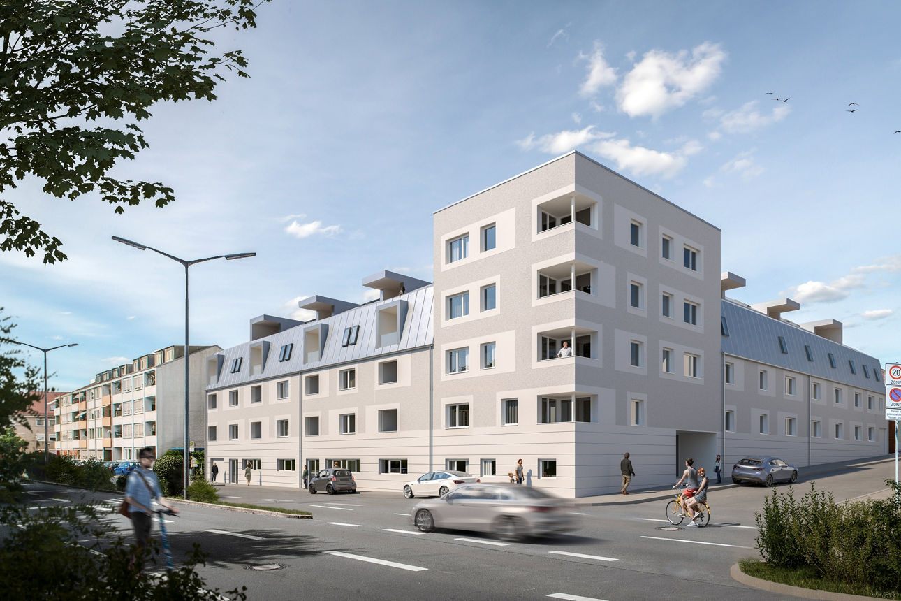 Ein Mehrgeschossiges Gebäude mit heller Fassade