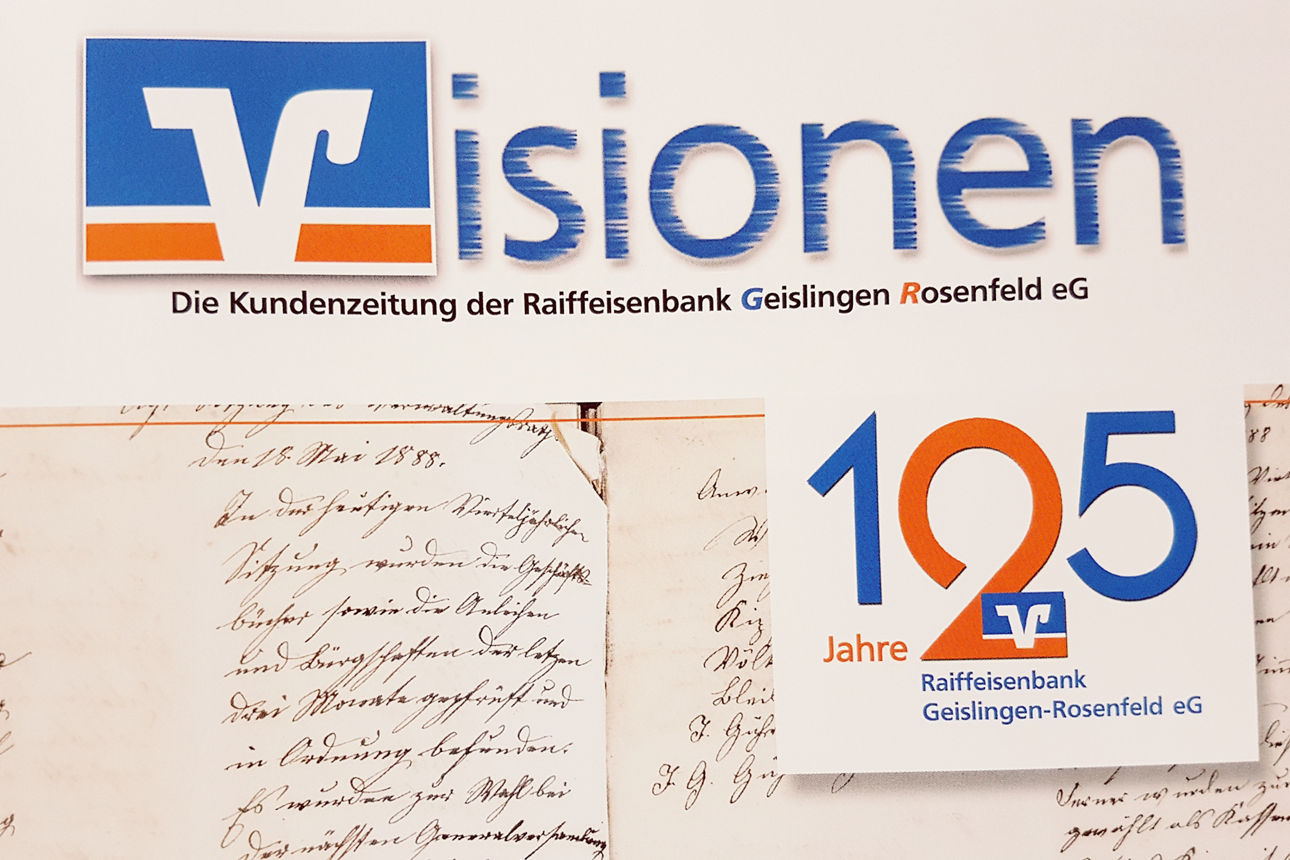 Aufschrift: Visionen, 125 Jahre. Dahinter die Darstellung eines alten Notizbuchs.