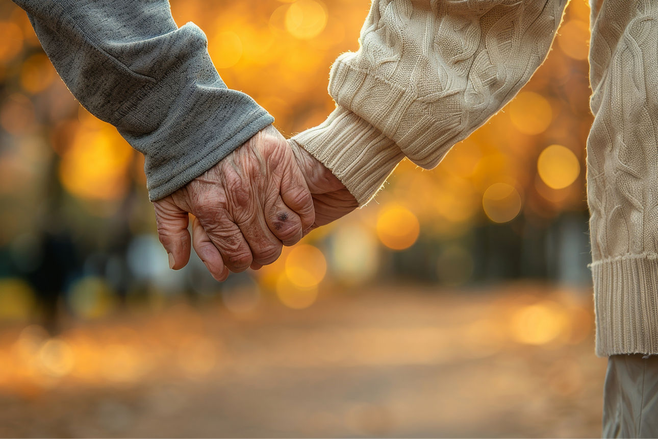 Nahaufnahme der Hände eines älteren Paares, die Hand in Hand gehen. KI genriert