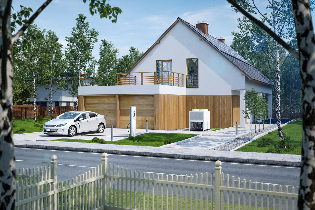 Modernes Haus mit E-Auto vor der Garage