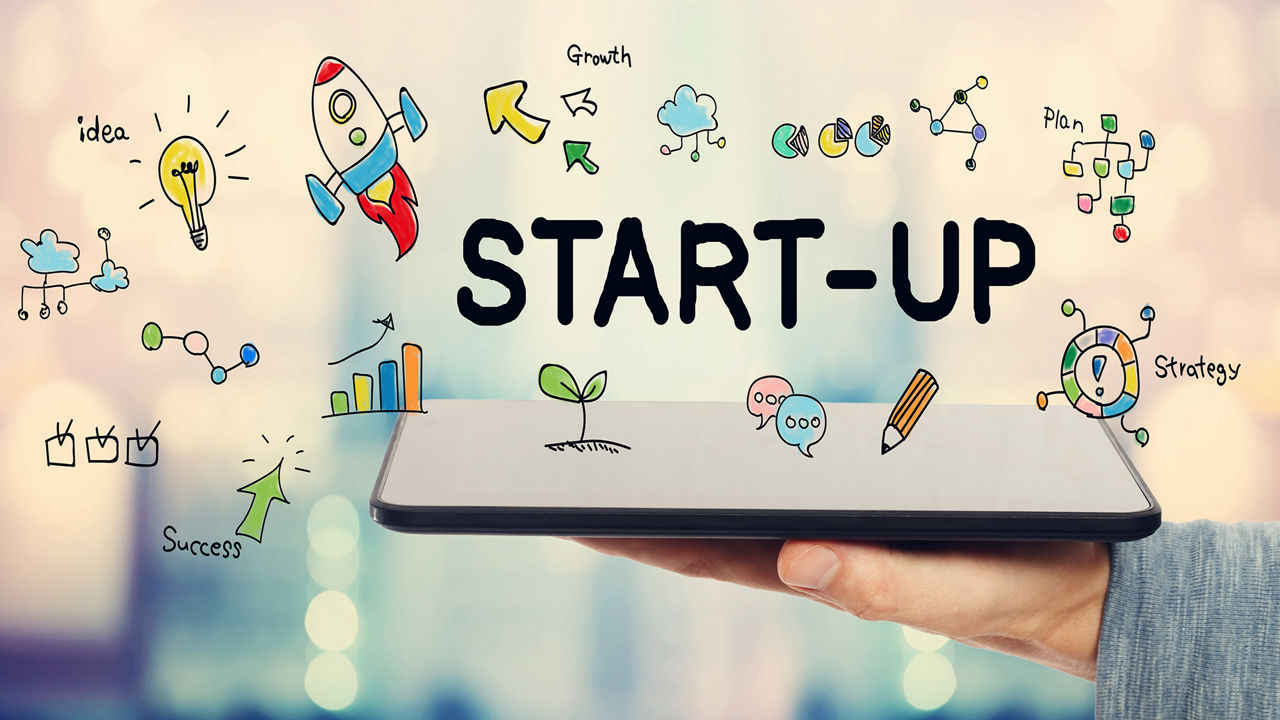 Start-Up-Konzept mit Mann, der ein Tablet hält