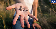 Hand mit Spruch Wir helfen