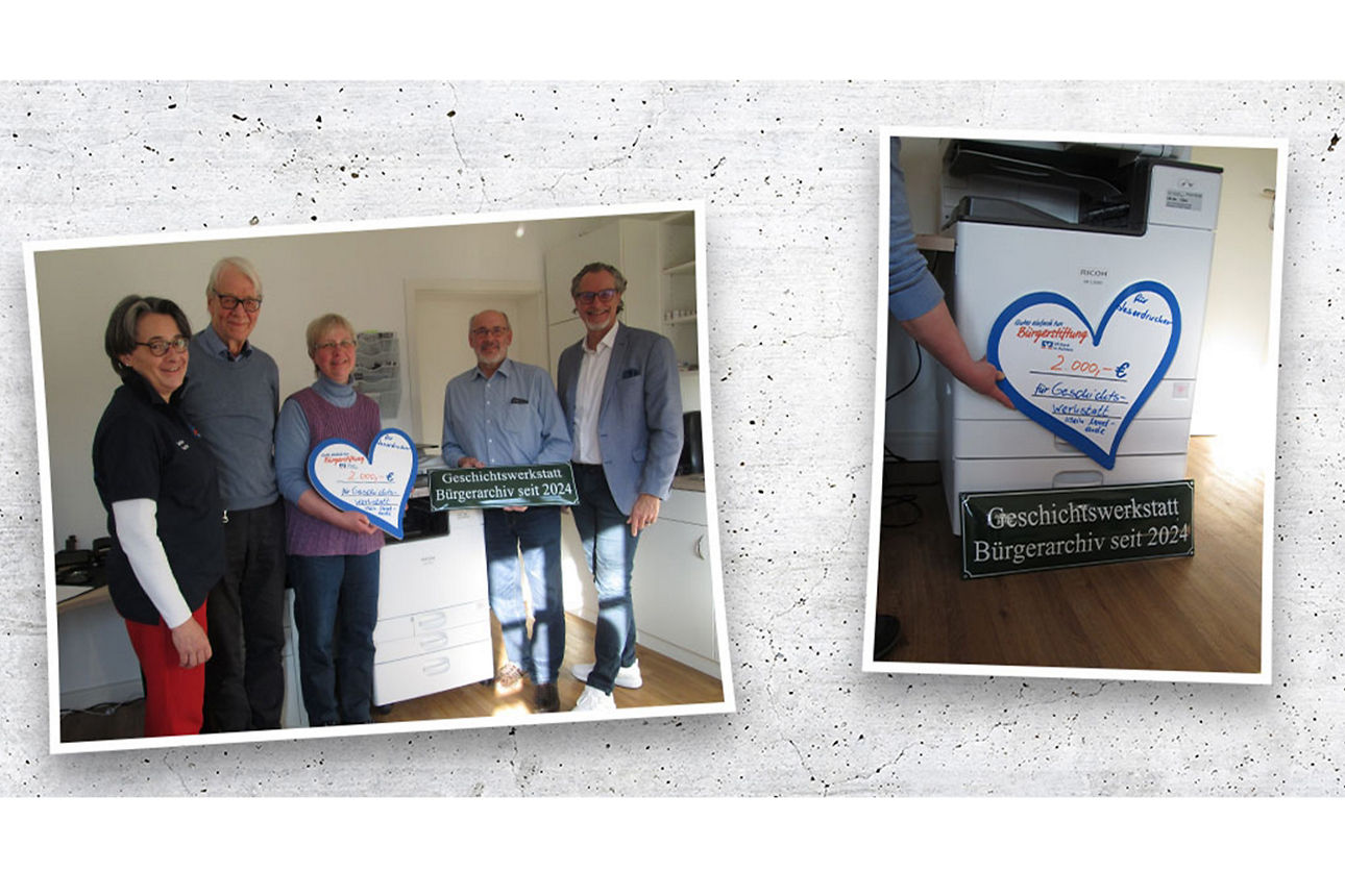 5 Menschen bei einer Scheckübergabe an die Geschichtswerkstatt