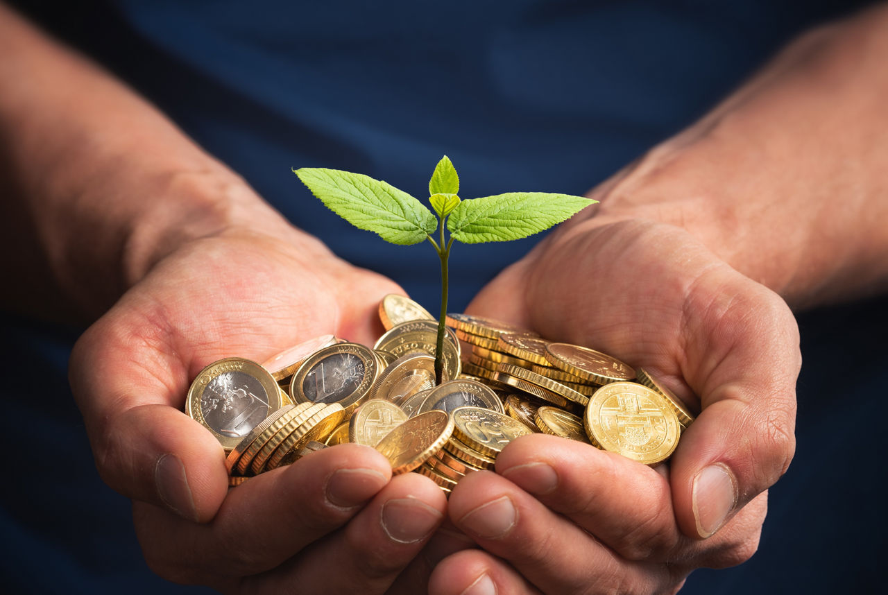Man Using euro money to invest in a new small business