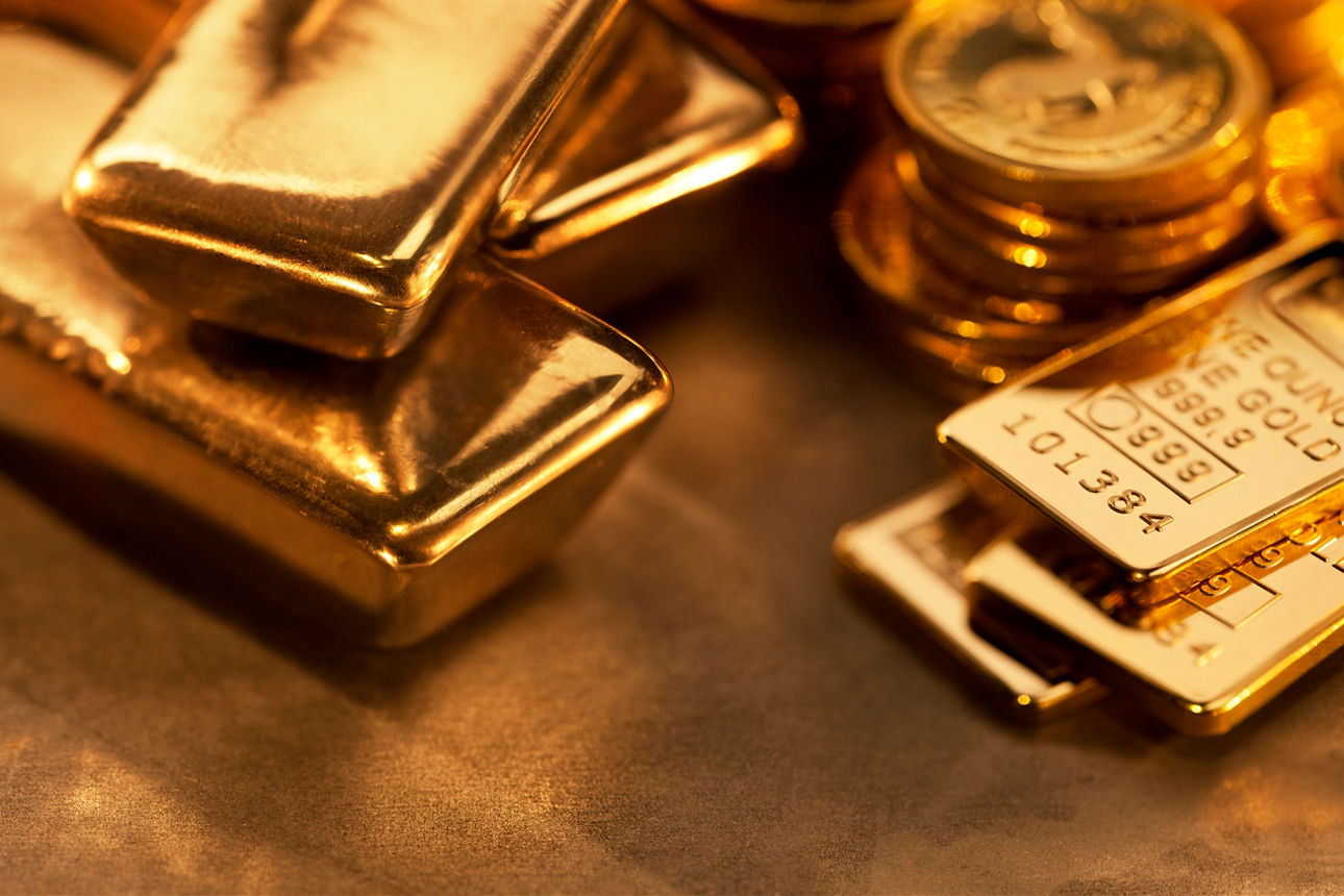 Goldmünzen und Goldbarren