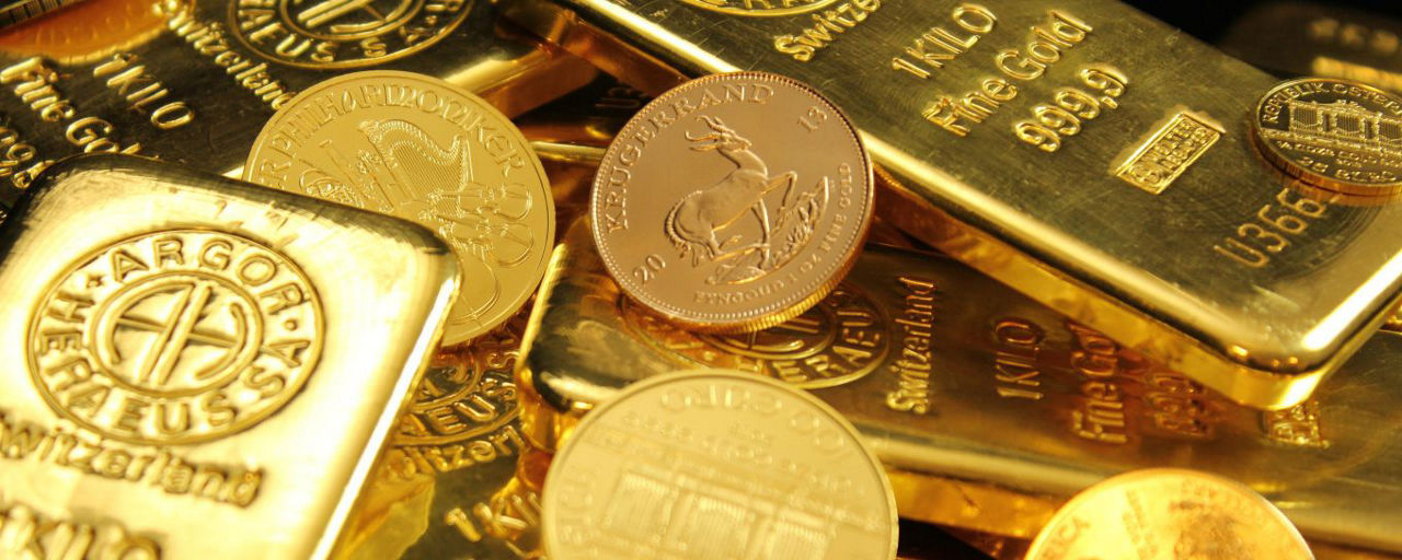 Goldbarren und Münzen