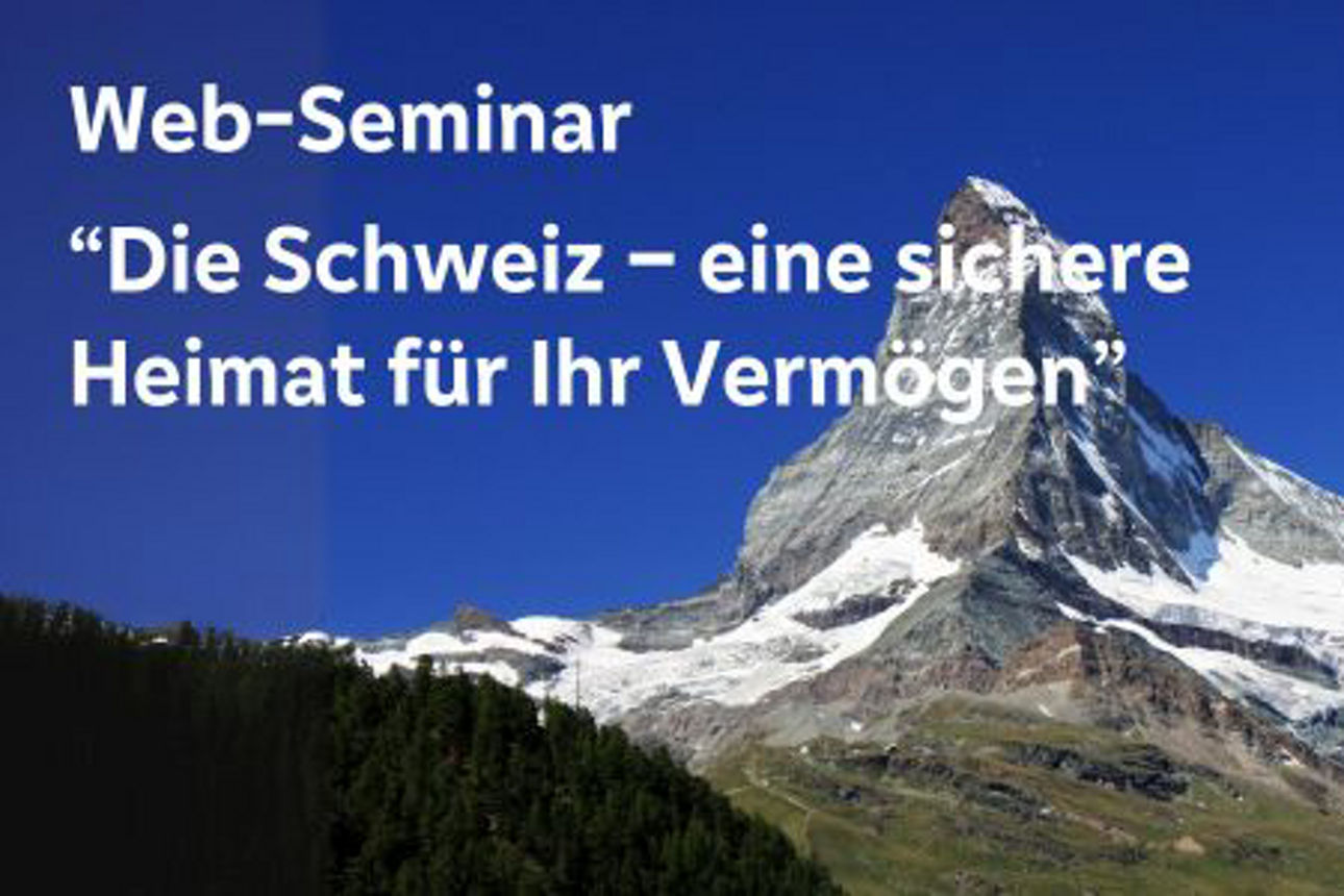 Landschaft mit dem Matterhorn im Hintergrund und einer schweizer Flagge