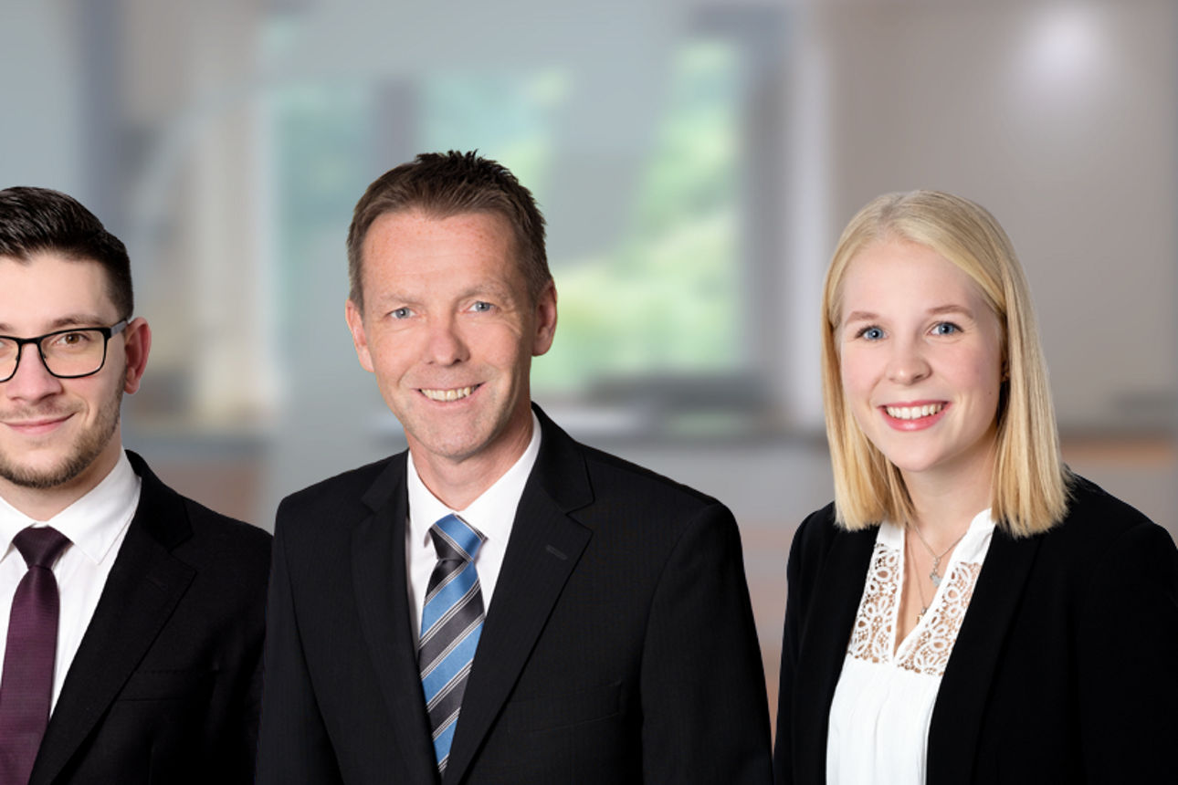 drei Mitarbeiter der Volklsbank Immobilien GmbH