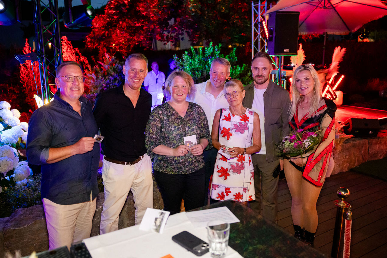 Gruppenportrait mit 7 Personen.