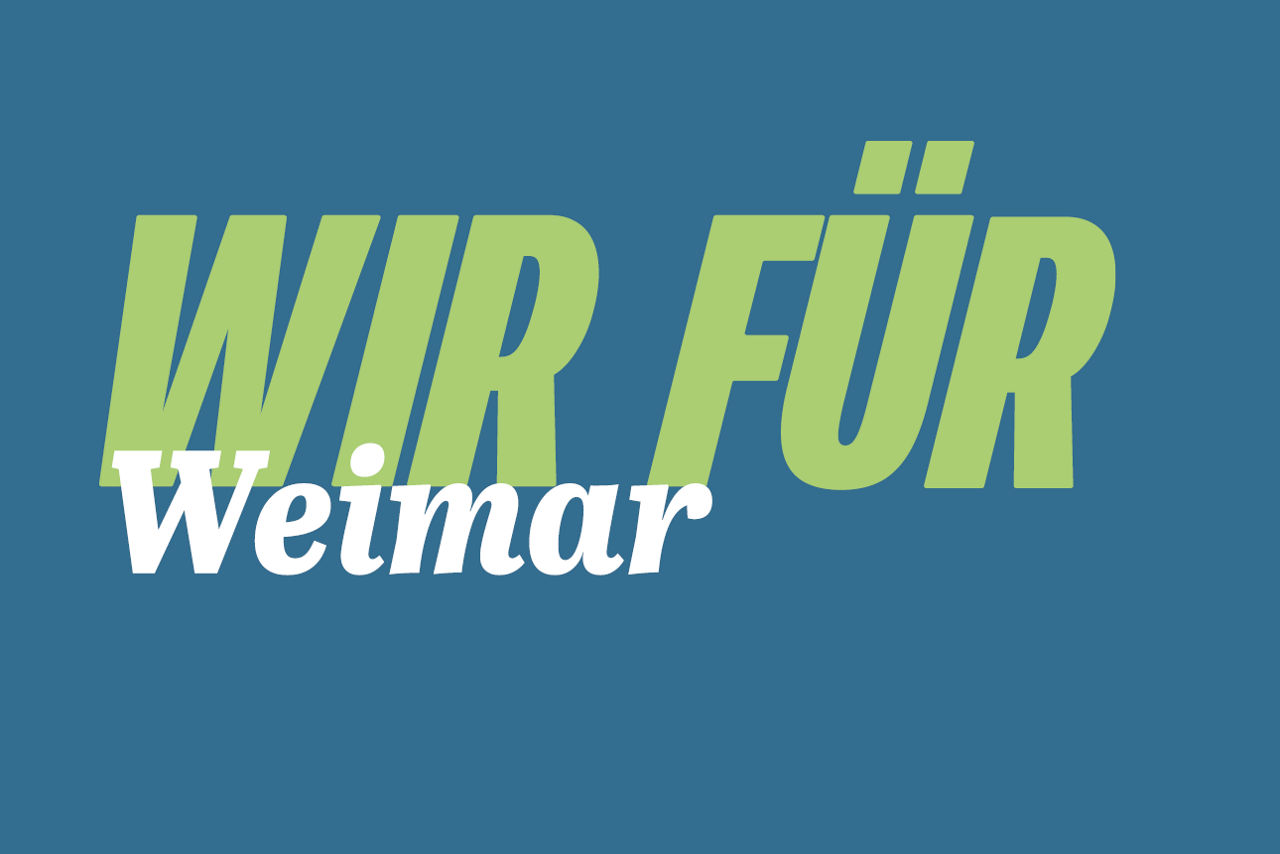 Grüner Schriftzug Wir für Weimar auf dunklem Hintergrund