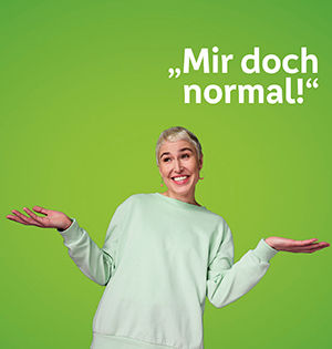 Frau mit grünem Pulli die sich denkt "Mir doch normal"