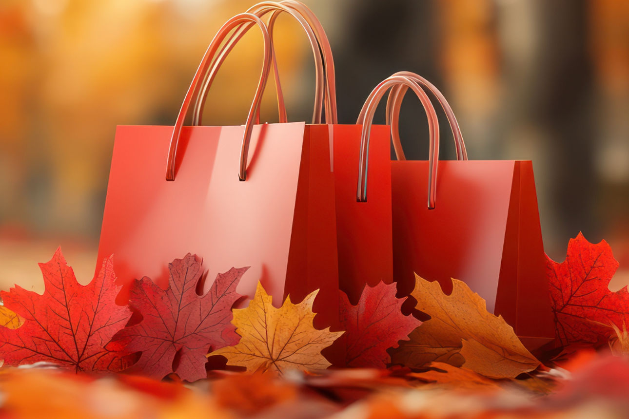 Zwei rote Taschen stehen im Herbstlaub
