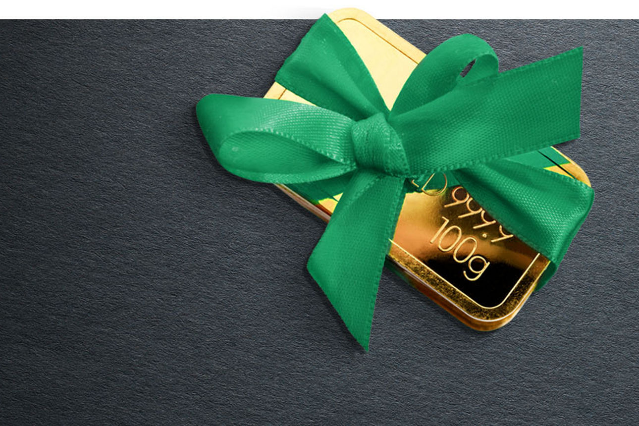 Goldbarren mit güner Schleife