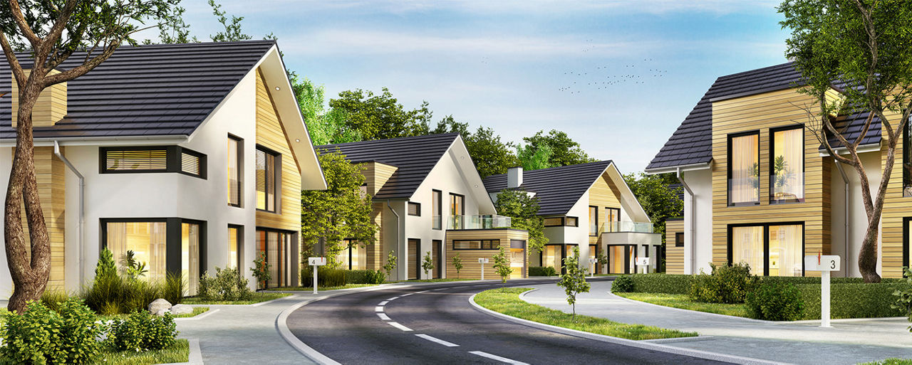 Die Grafik zeigt eine Straße mit vielen Neubauhäusern. Das Bild zeigt einen sonnigen Tag. Die Bäume sind grün.