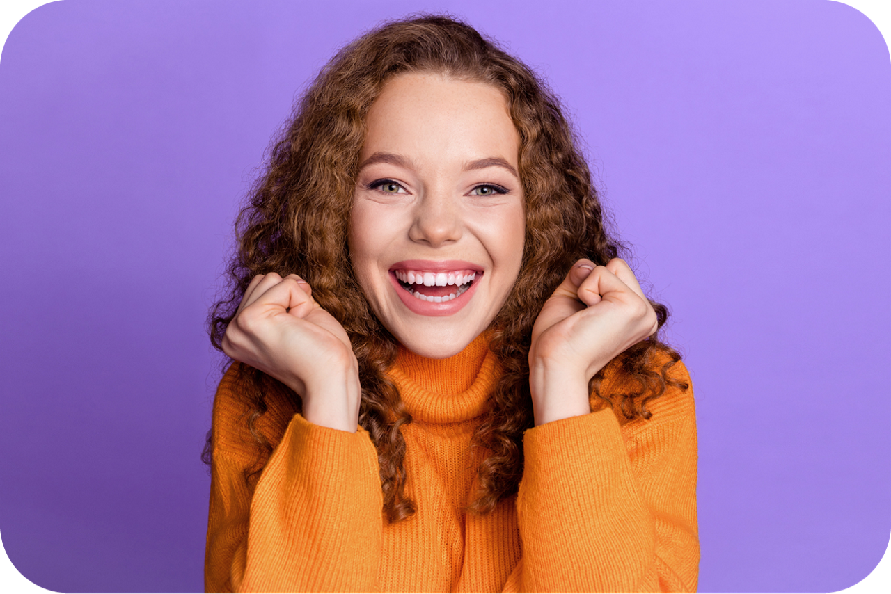 Photo of young women standing in front of a isolated violet background