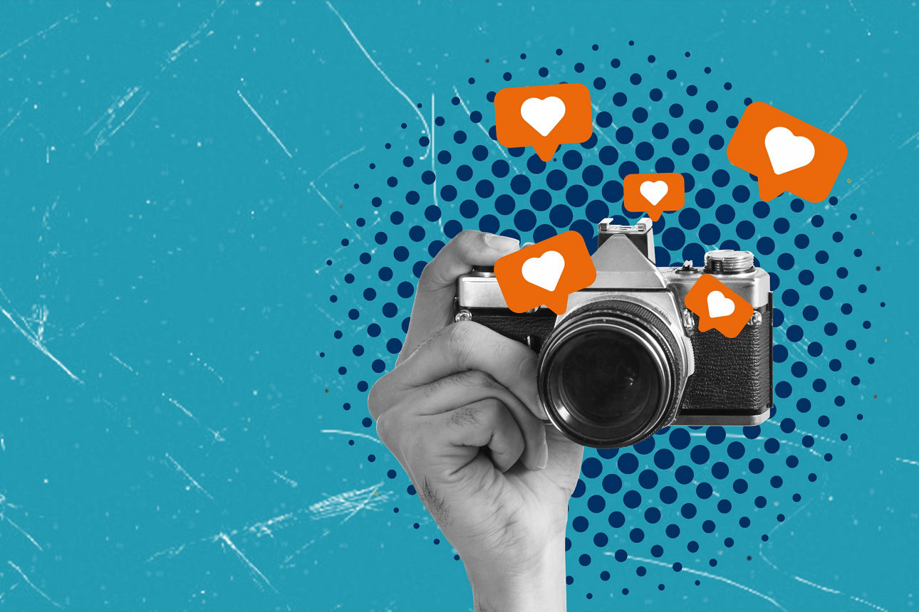 Creative composite photo collage depicting a hand holding a vintage camera and taking a photo on social media, on a blue background with copy space the concept of advertising and promotion.