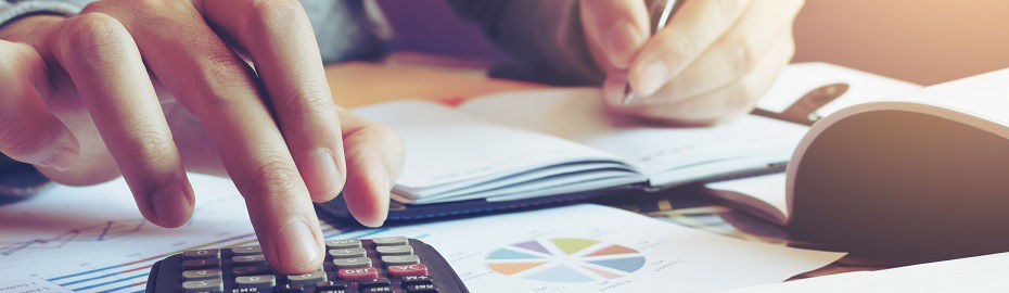 Close up hand man doing finance and calculate on desk about cost at home office.