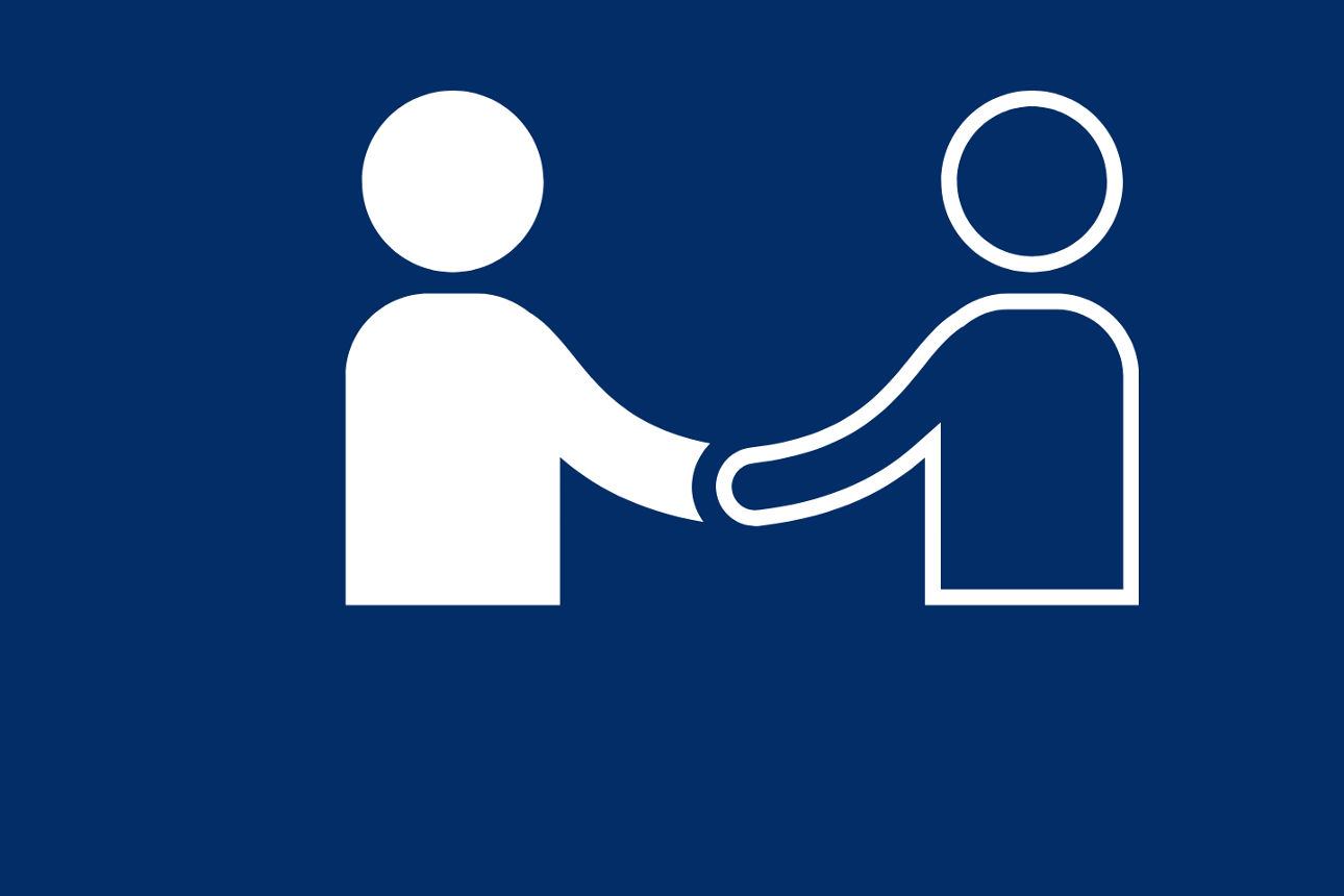 Zwei menschliche Figuren reichen sich die Hände.