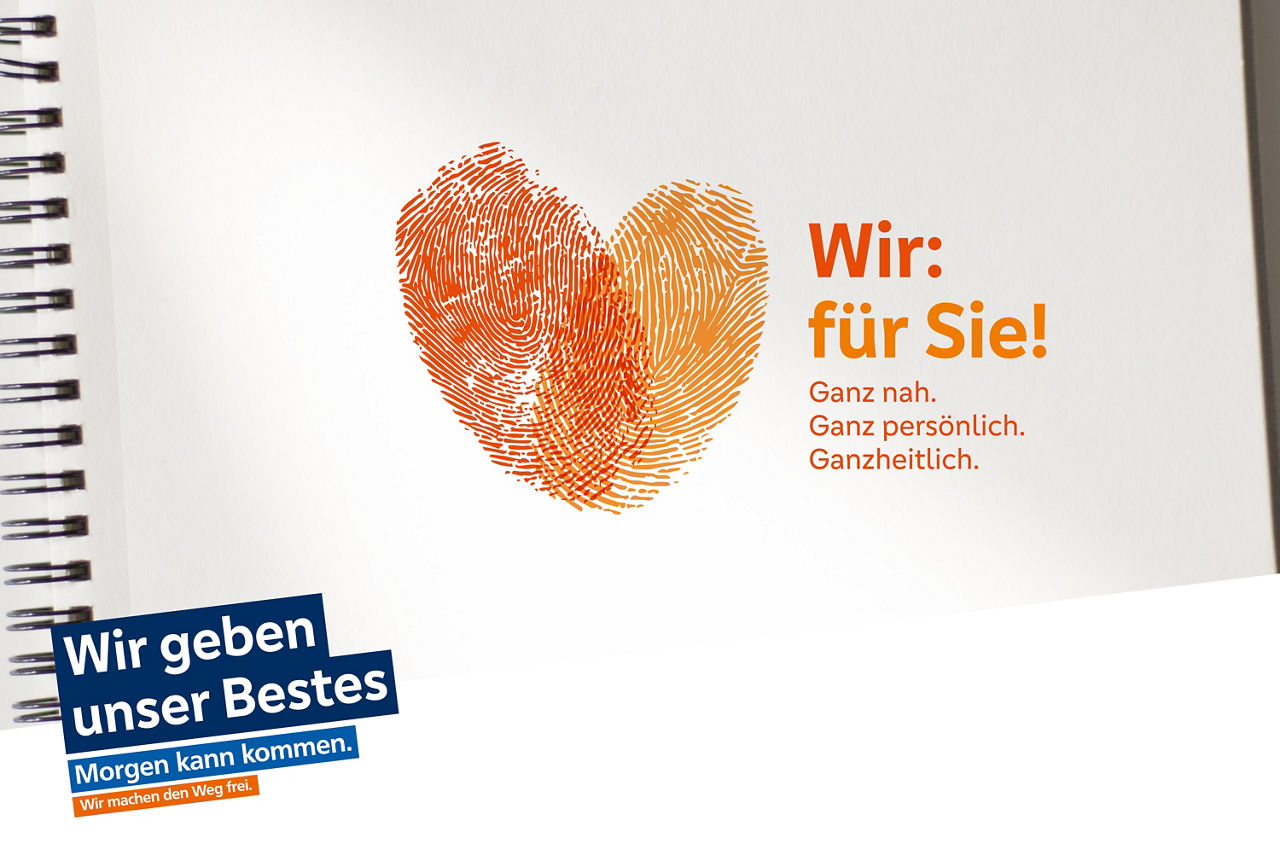 Zwei Fingerabdrücke in rot und orange bilden ein Herz. TExt: Wir. für Sie! Wir geben unser Bestes. Morgen kann kommen. Wir machen den Weg frei.