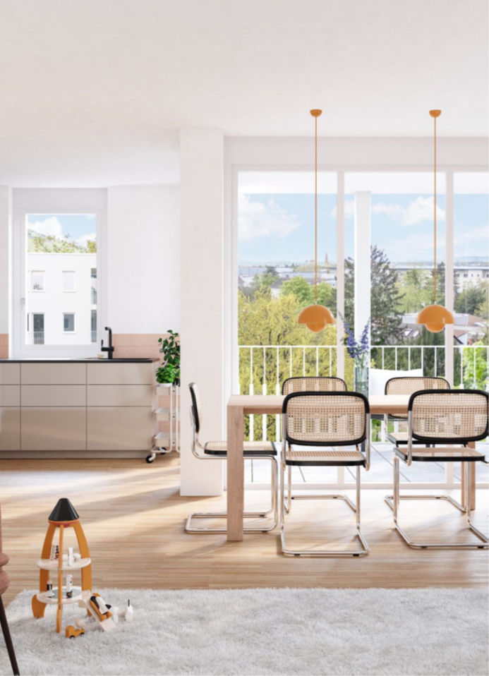 Heller Küchen- und Essbereich mit großen Fenstern und Blick ins Grüne.