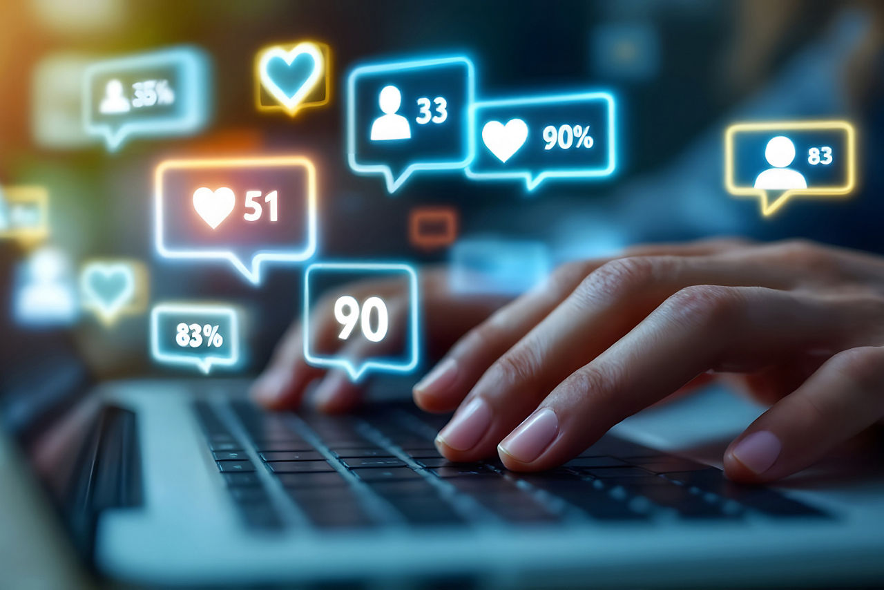 Social Media Engagement on Laptop, Typing on Laptop with Social Media Icons, Online Interaction and Social Media Notification