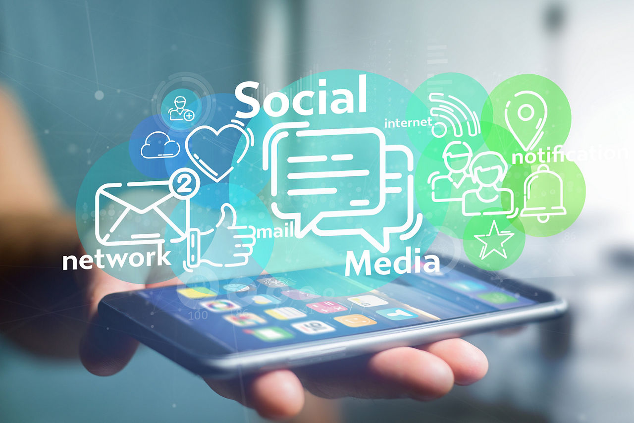 View of a Businessman holding a cloud of social media network icon