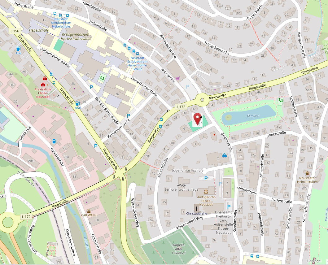Ausschnitt eines Stadtplans mit Straßen, Gebäuden, Grünflächen und einer markierten Position in zentraler Lage.