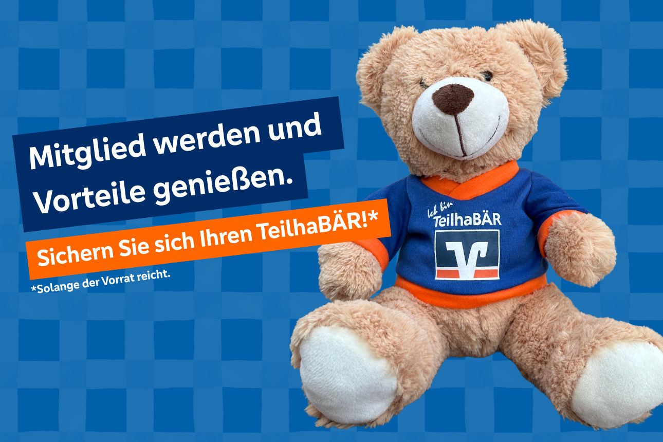 Bild zeigt einen Teddybär aus Plüsch mit VR-Logo und dem Aufdruck Ich bin TeilhaBÄR.
