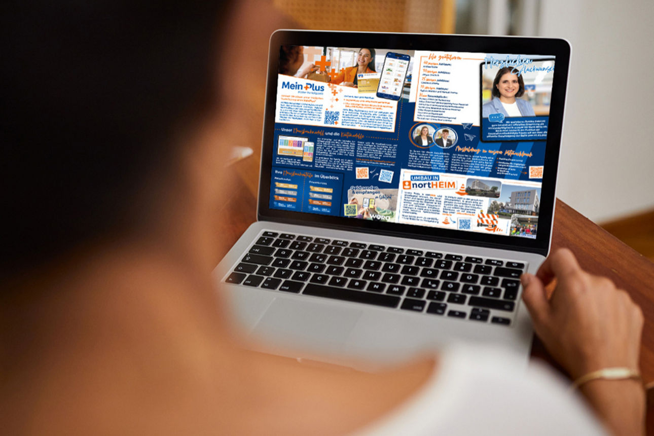 Bildausschnitte der Mitgliederzeitung auf dem Desktop vom Laptop