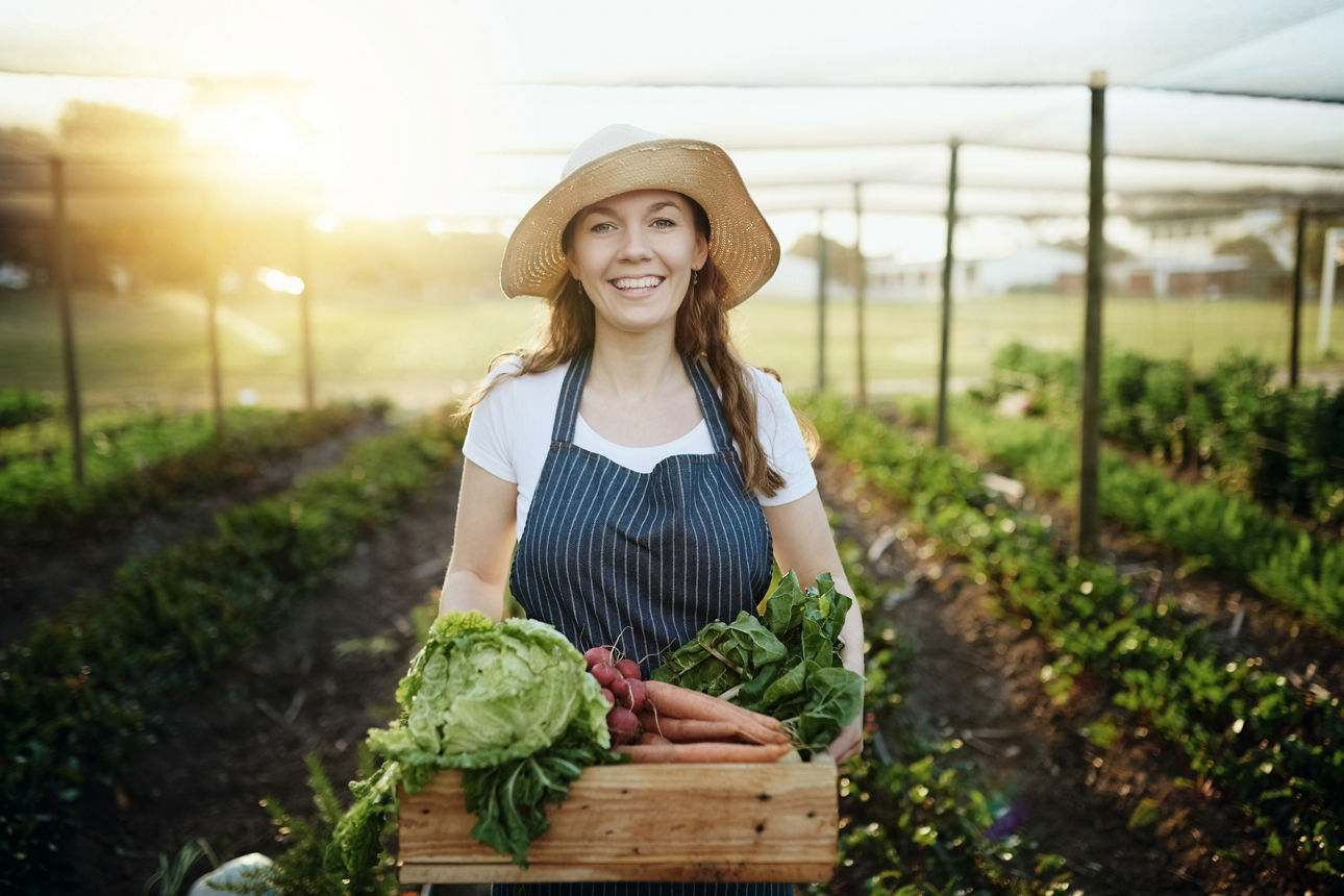 Cropped shot of an attractive young woman working on her self owned farm