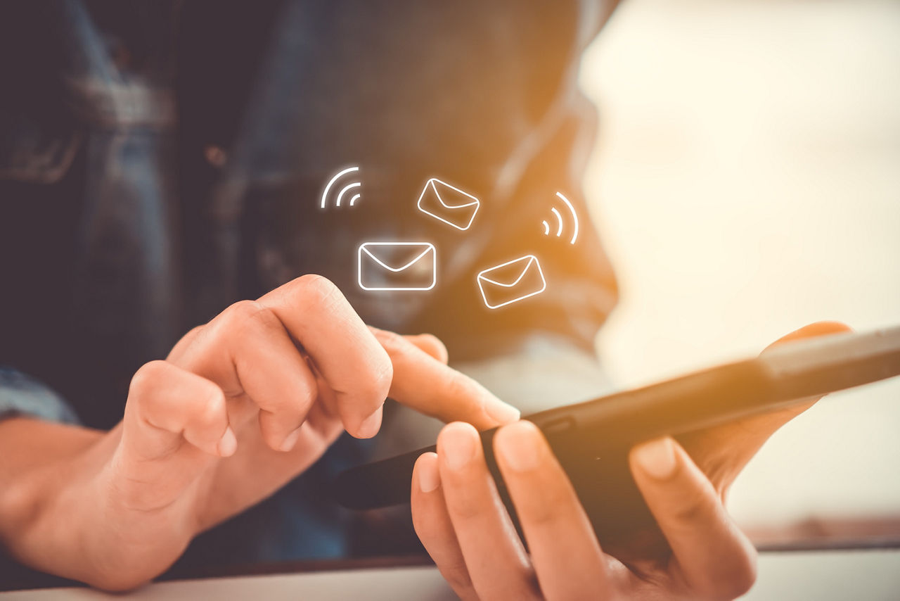 Woman hand using smartphone to send and recieve email. Business communication  technology concept.