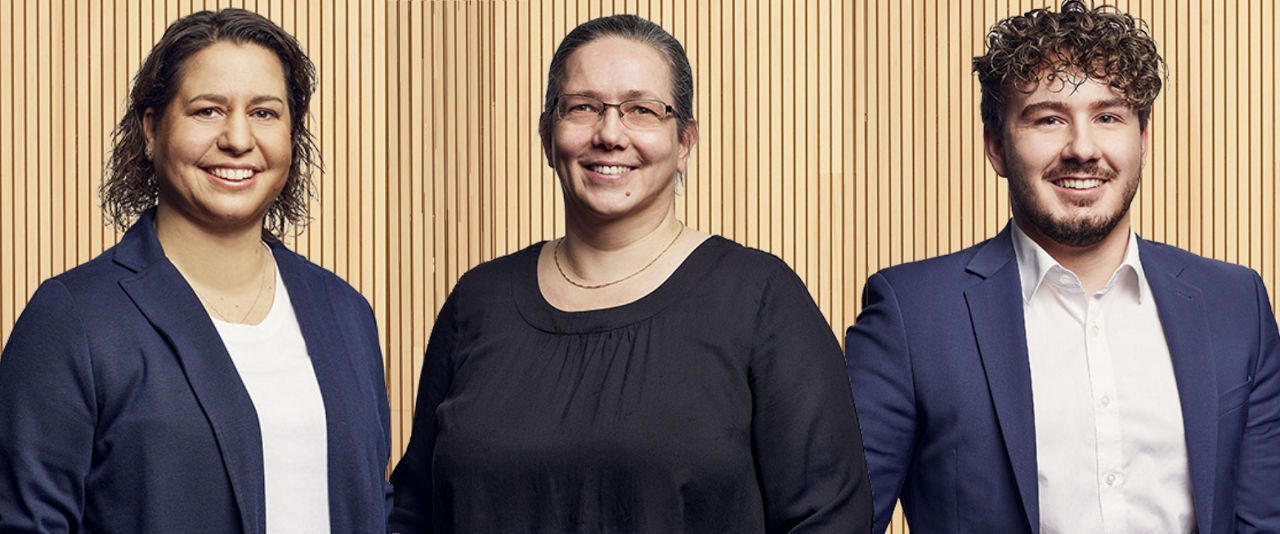 Abbildung von drei Kollegen nebeneinander