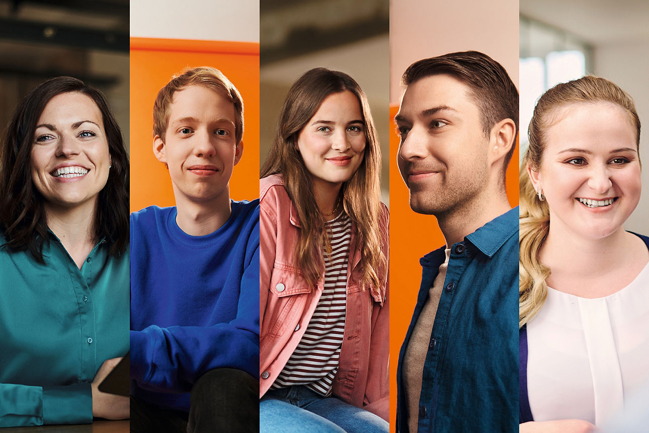 Fünf Personen verschiedenen Geschlechts, Alters und Aussehens lächeln freundlich in die Kamera